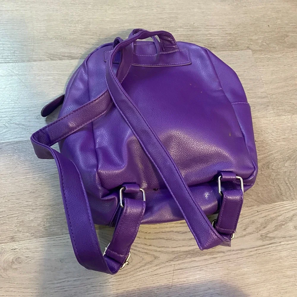 The Crayon Case Mini Backpack Womens Small Purple Faux Leather Logo Bag